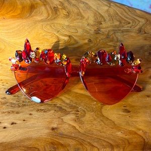 Heart shaped pink sunglasses with red orange rhinestones and gemstones